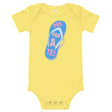 prepárate on a chancleta on a yellow onesie